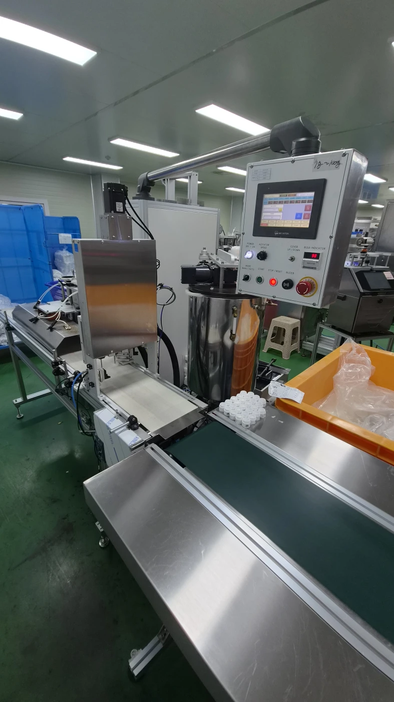 Filling conveyor and control panel